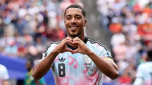 Youri Tielemans makes a heart sign with his hands after scoring Belgium's third goal against Senegal during the 2026 World Cup